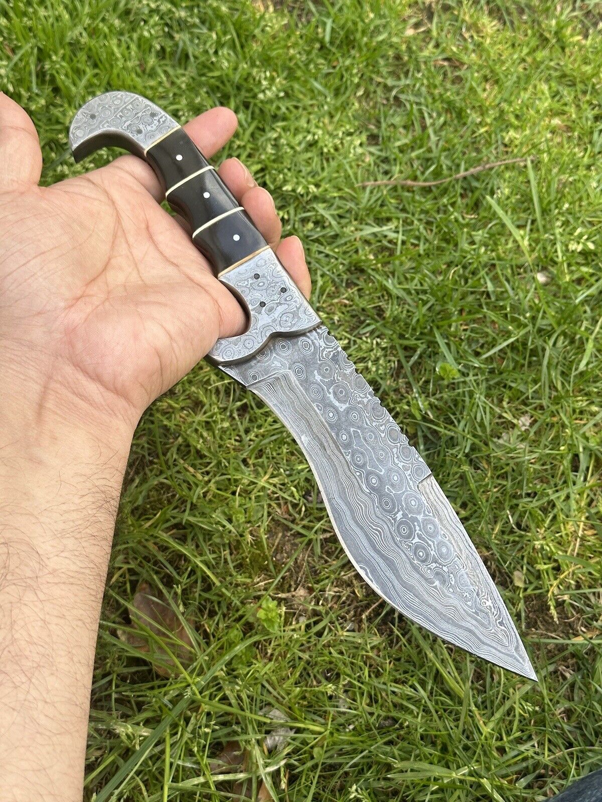 Custom 12" Damascus steel hunting knife with buffalo horn handle and leather sheath