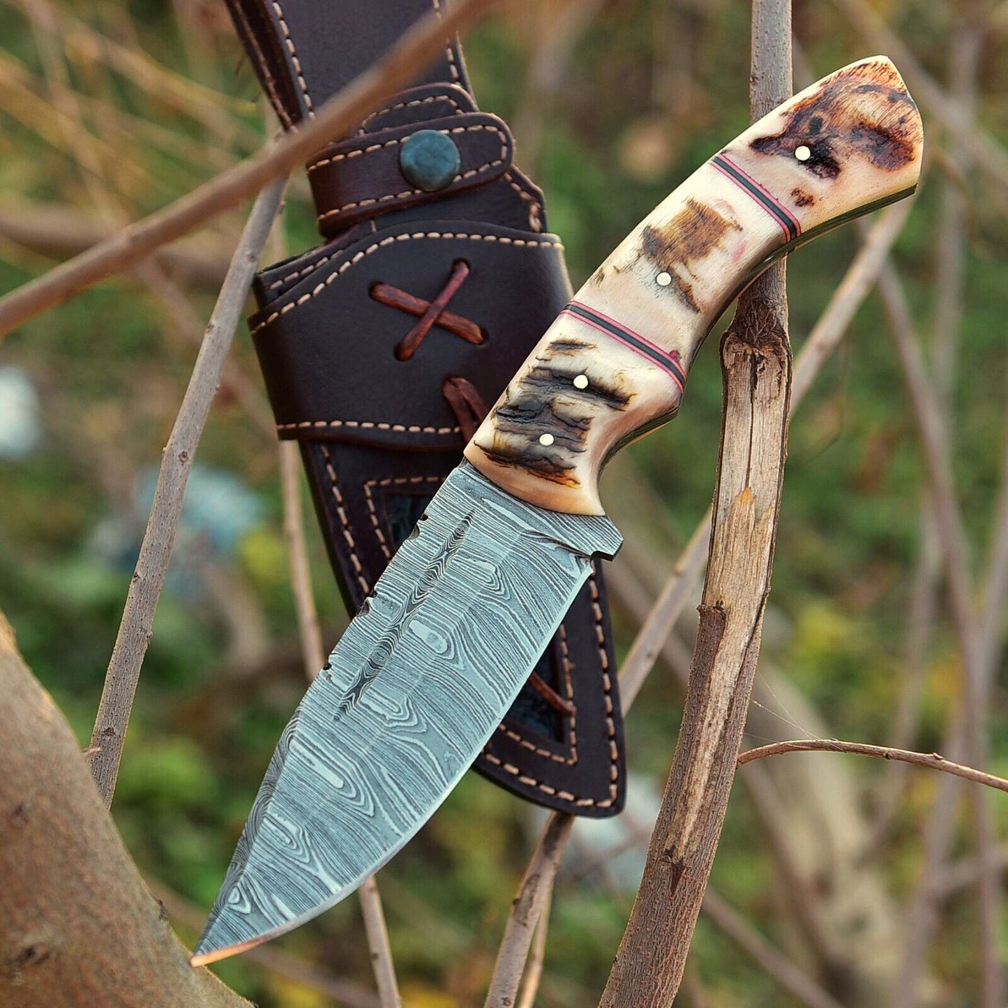 Custom handmade Damascus skinning knife with a 4.5-inch blade and sheep horn handle, perfect for precision skinning and hunting applications