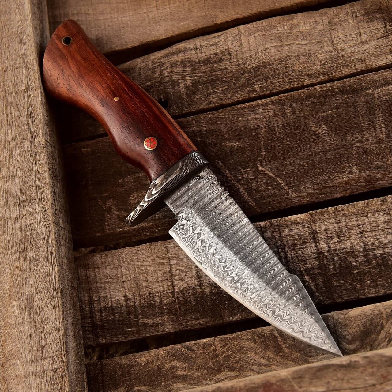 Custom handmade Damascus steel hunting knife with a 5-inch blade and elegant rosewood handle, shown with a leather sheath