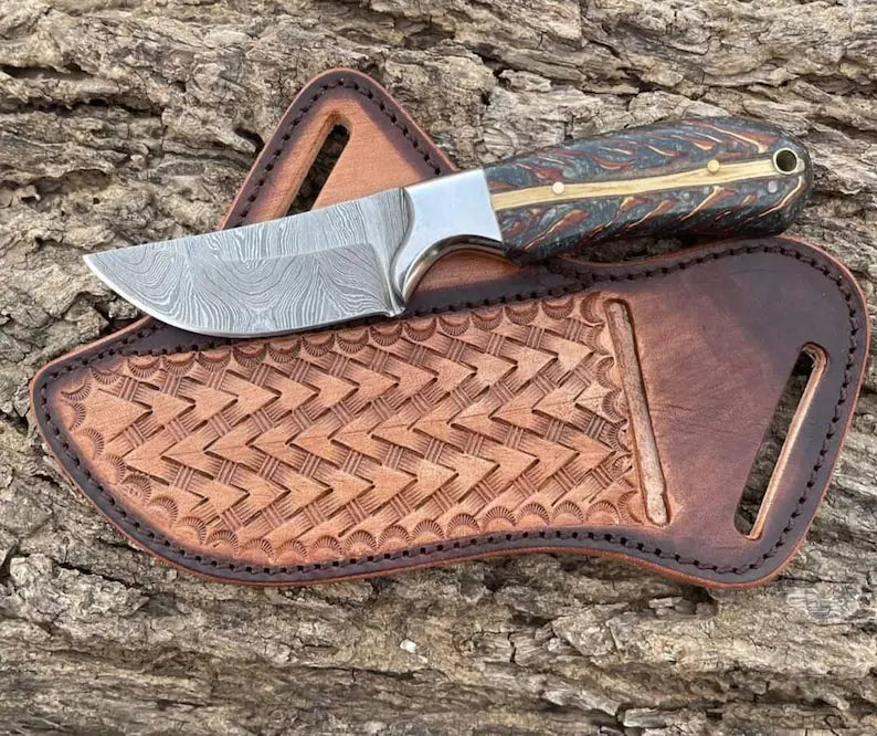 Custom handmade cowboy knife with a Damascus steel blade, pine cone handle, steel bolster, and belt rope leather sheath, ideal for outdoor and collectible use