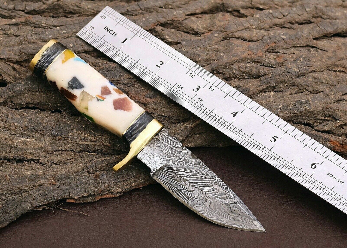 "Custom handmade outdoor knife with a 3-inch Damascus steel blade."