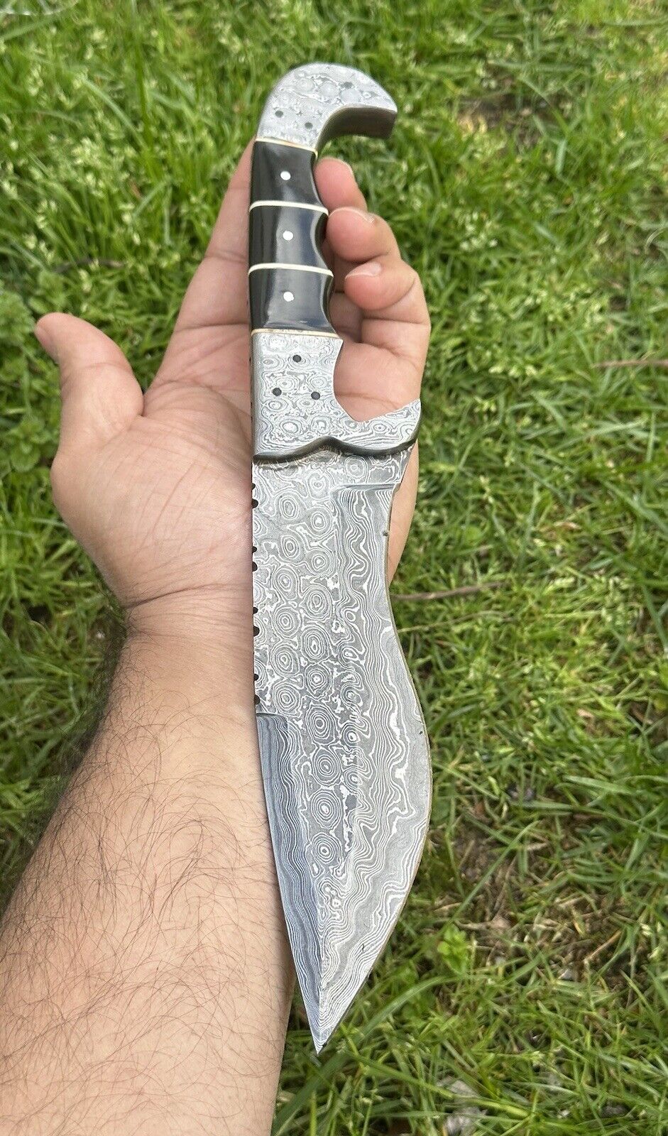 Damascus steel hunting knife with buffalo horn handle and Damascus steel bolster, perfect for gifting