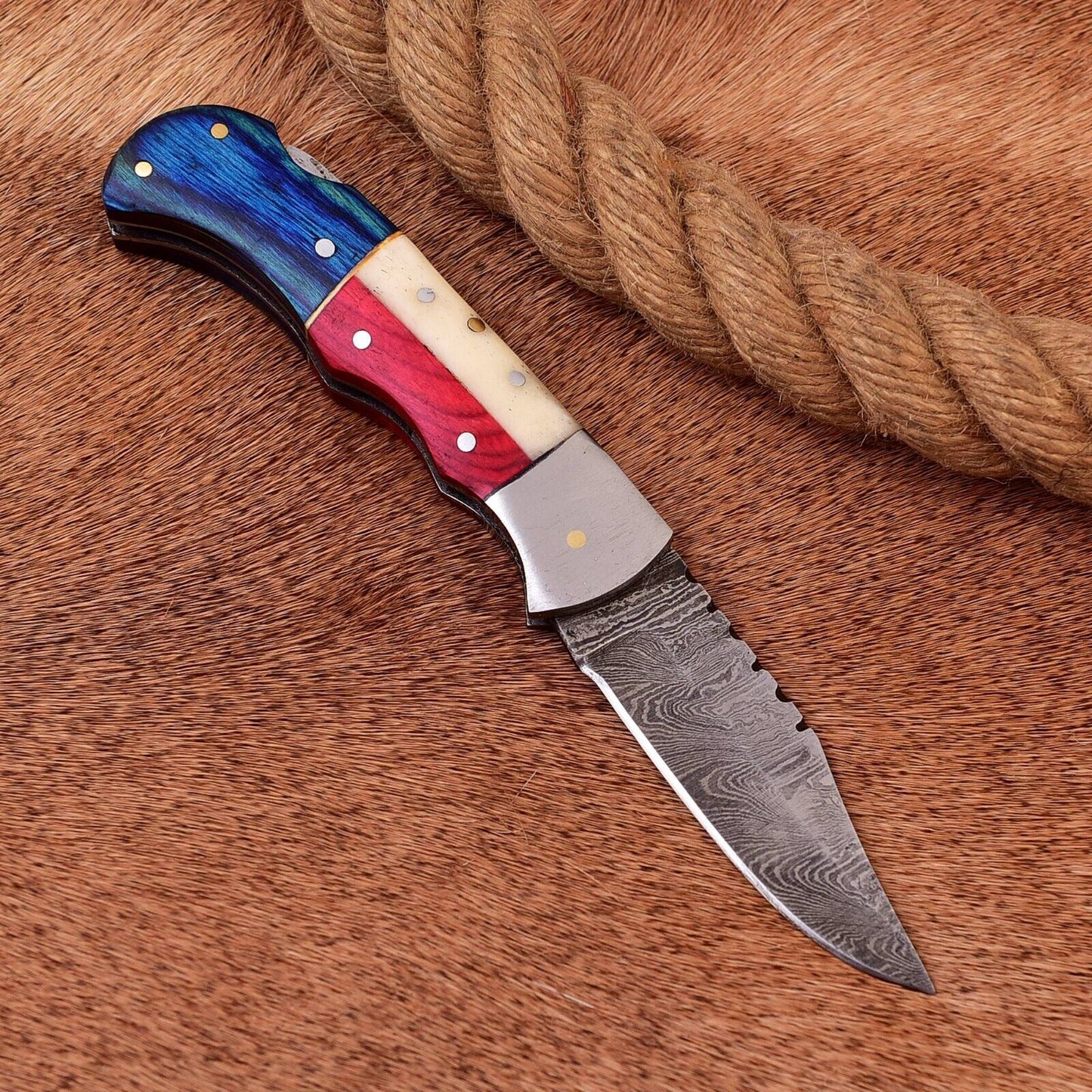 "Handcrafted 3-inch Damascus steel pocket knife featuring Texas flag design"