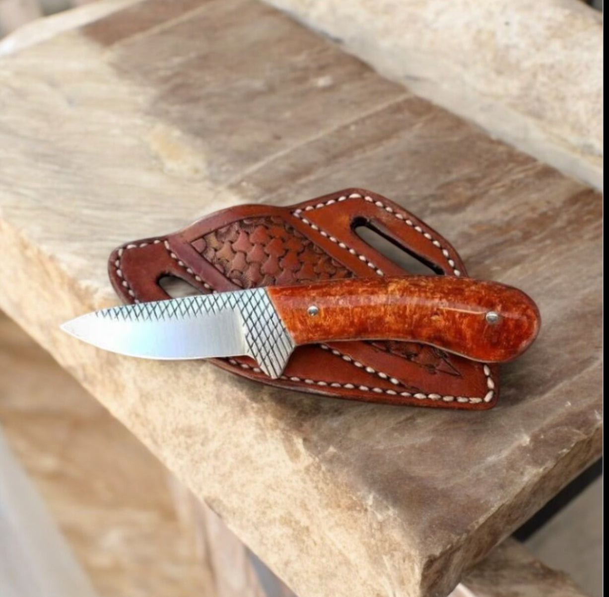 "Handcrafted Western belt knife with rasp tool steel blade and resin handle"