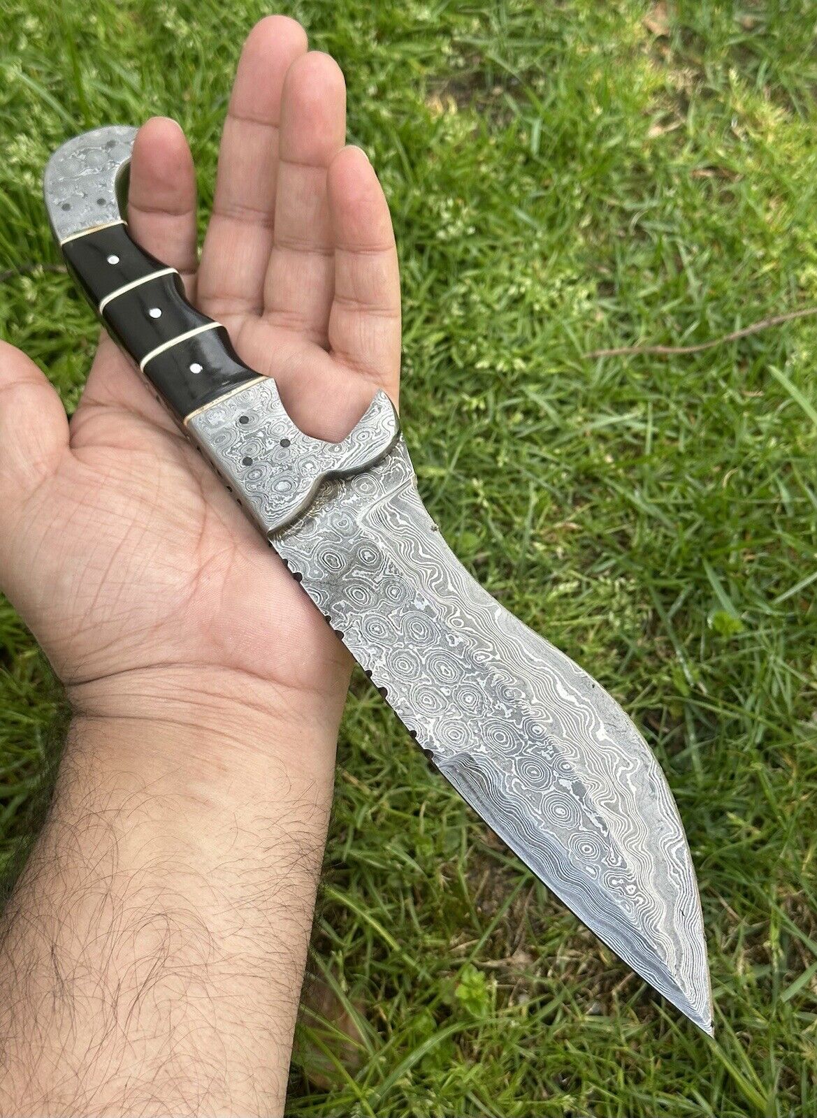 Handmade 12" Damascus blade hunting knife with buffalo horn handle, includes leather sheath.