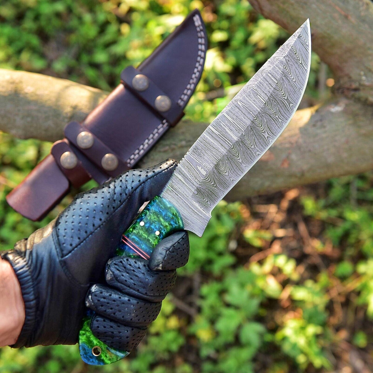 Premium custom handmade skinning knife with a sharp 4.5-inch Damascus steel blade and durable resin handle, crafted for precision skinning, hunting, and outdoor use; ideal for hunters and collectors