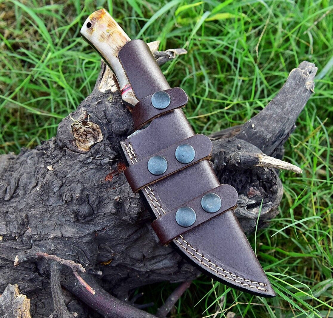 Premium skinner knife with ergonomic sheep horn handle and leather sheath