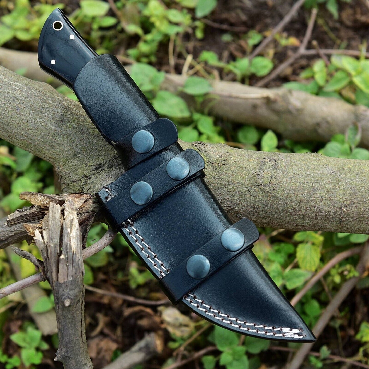 Premium skinning knife with handcrafted Damascus steel blade and buffalo horn/camel bone handle, perfect for hunters and collectors
