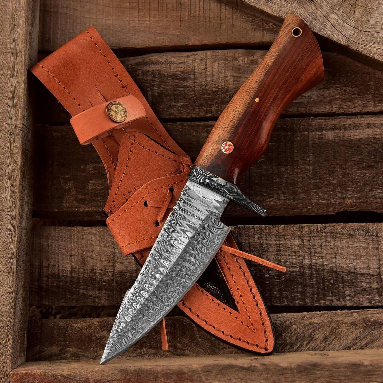 Small hunting knife with a Damascus steel blade and rosewood handle, featuring a Damascus steel guard, perfect for outdoor use