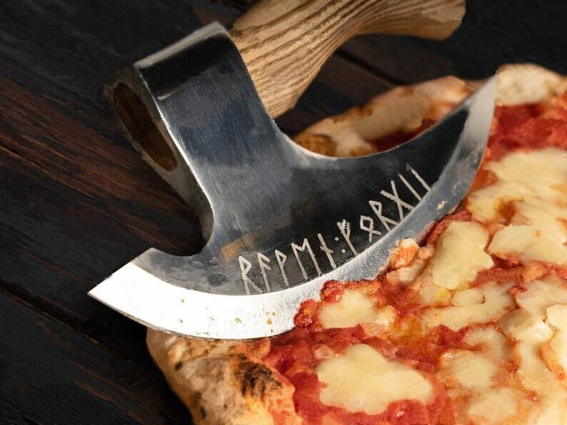 Stylish custom ax pizza cutter slicing pizza