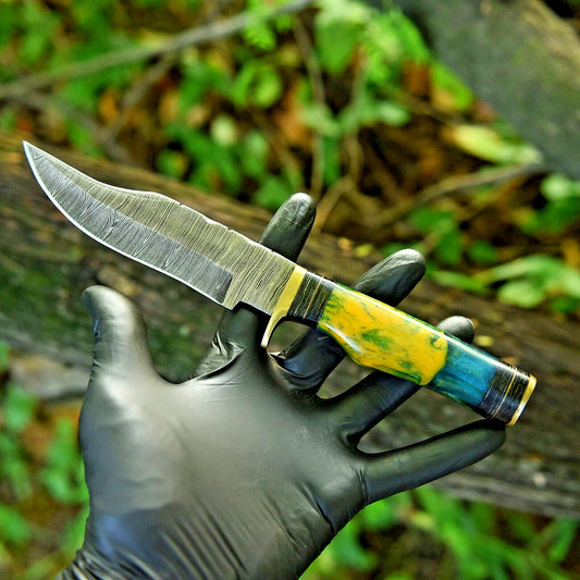 10-inch Damascus steel hunting knife with brass guard and resin pakkawood handle.