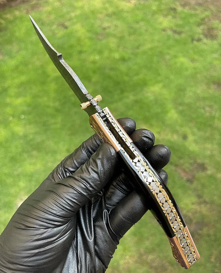 3-inch Damascus folding knife with brass engraved bolster and bone handle, complete with leather sheath.