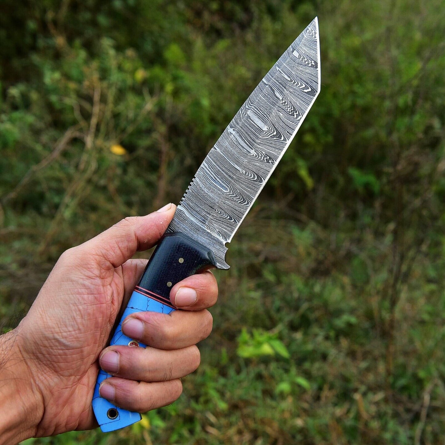 4.5-inch Damascus steel skinning knife with a custom handmade resin handle, ideal for hunting and skinning tasks