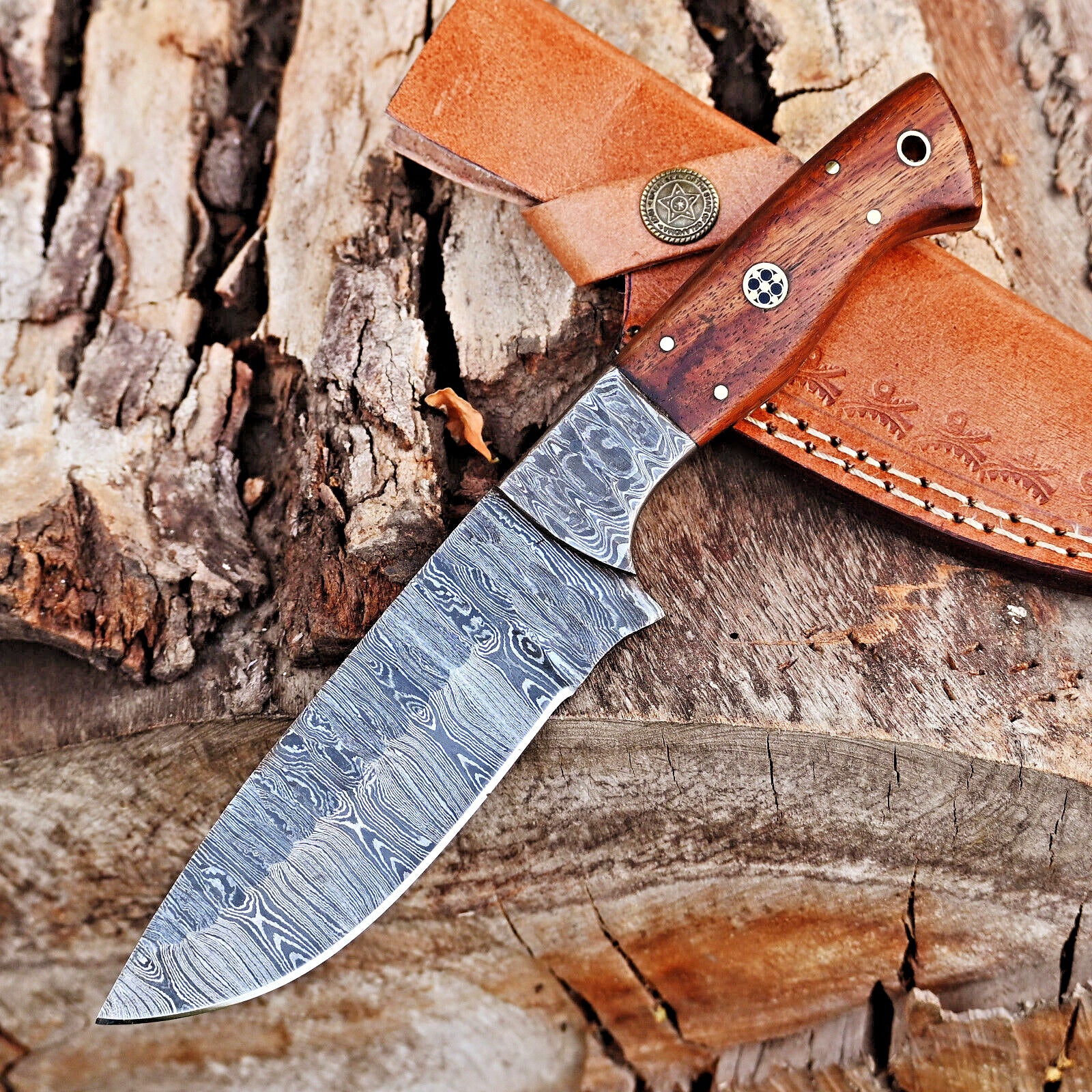 5-inch Damascus steel blade skinning knife with ergonomic rosewood handle and decorative Damascus bolster, perfect for hunters and collectors