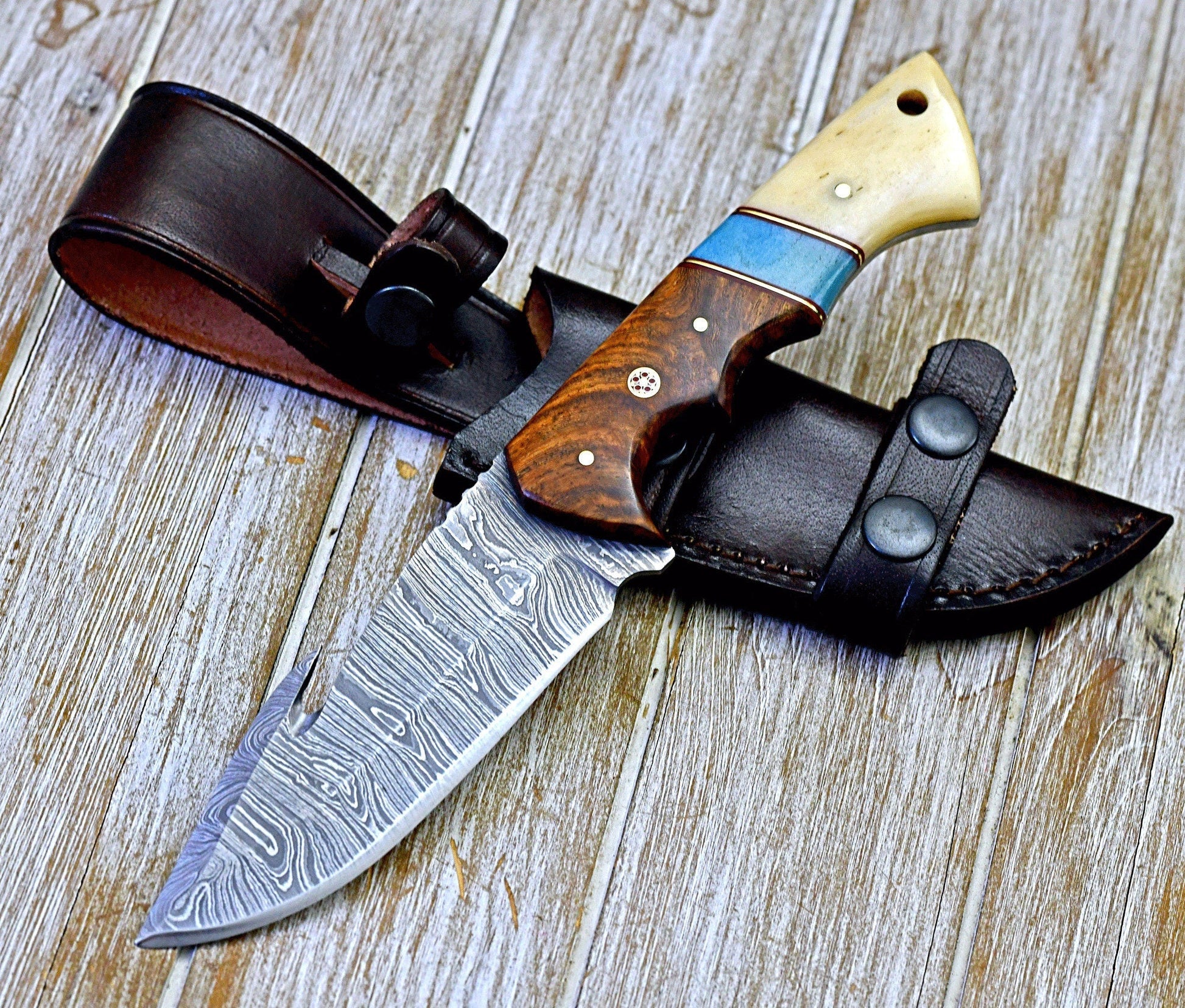 5.5" Damascus blade guthook knife with a stylish rosewood and bone handle