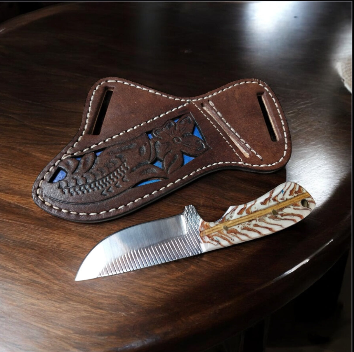 "Back of belt knife with rasp tool blade, white pine cone handle, and leather belt loop case – 7.5" overall length."

