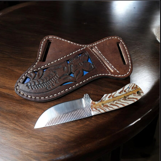 "Back of belt knife with rasp tool blade, white pine cone handle, and leather belt loop case – 7.5" overall length."

