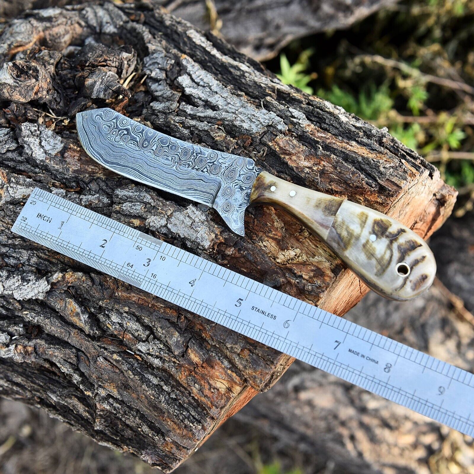 Close-up of Whiskey Knives Out Blade with Leather Sheath

