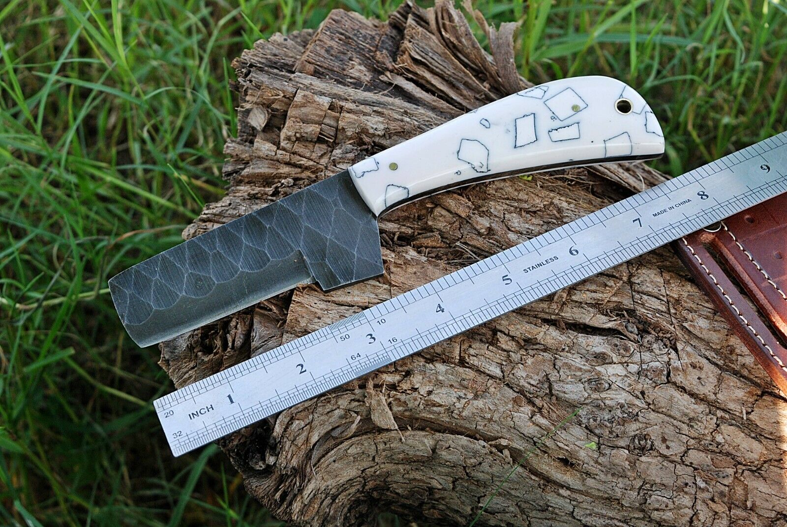 Close-up of a cowboy bull cutter knife featuring a hand-forged J2 steel blade