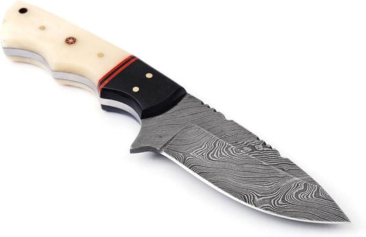 Close-up of custom handmade Damascus steel skinning knife with 4.5-inch blade, featuring a buffalo horn and camel bone handle