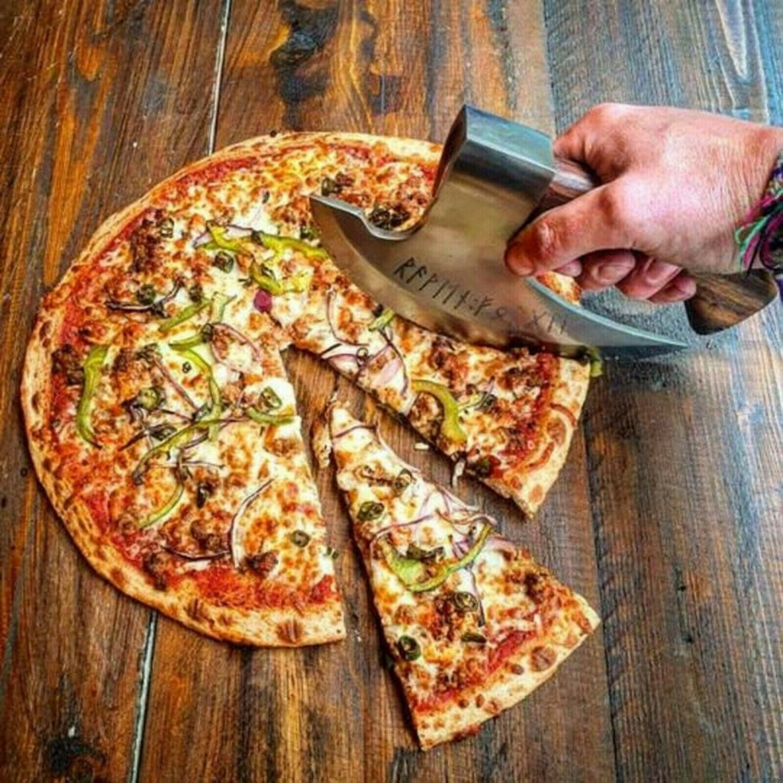 Close-up of wooden handle on the axe pizza cutter