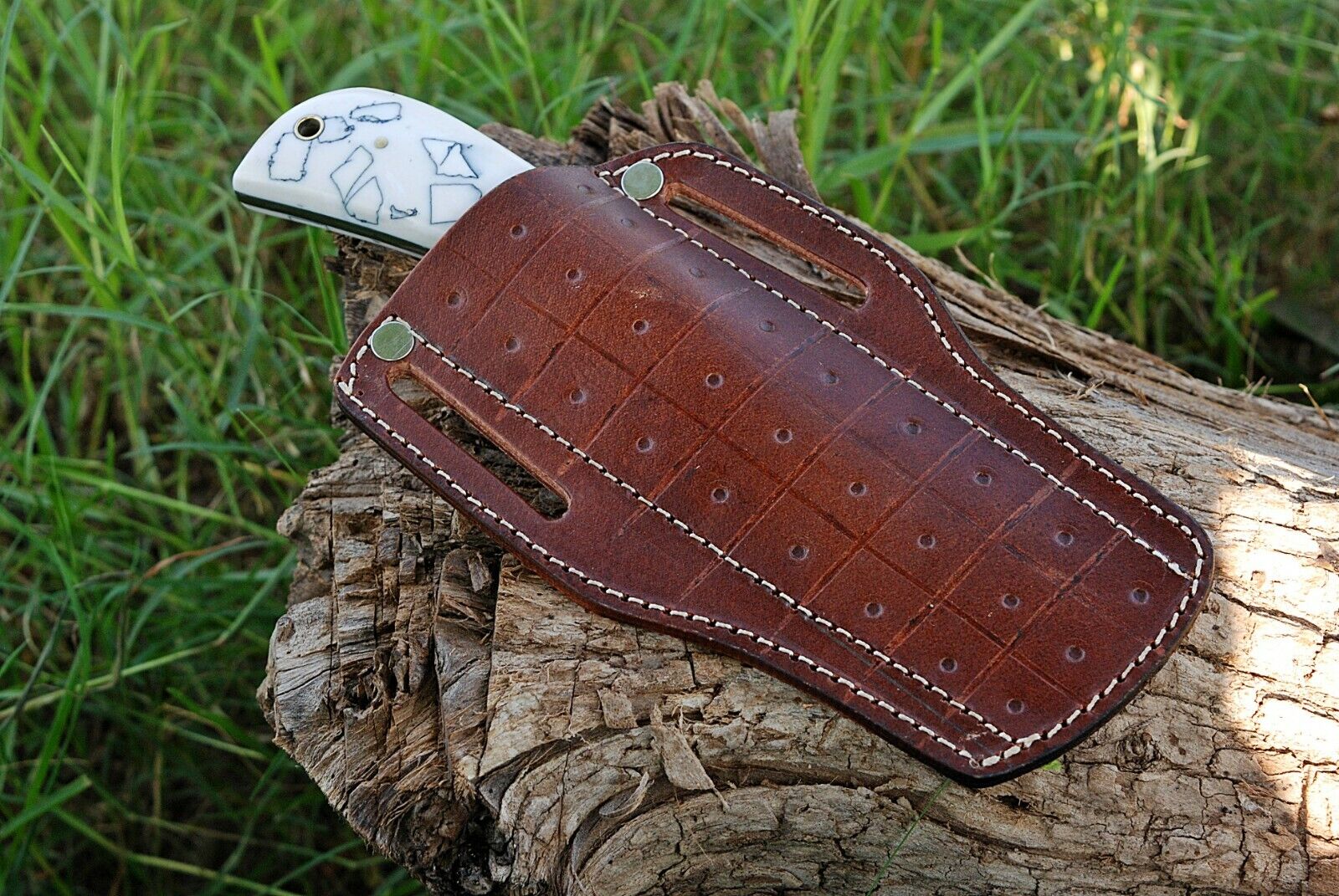 Cowboy bull cutter knife with resin handle and 4-inch J2 steel blade in leather sheath