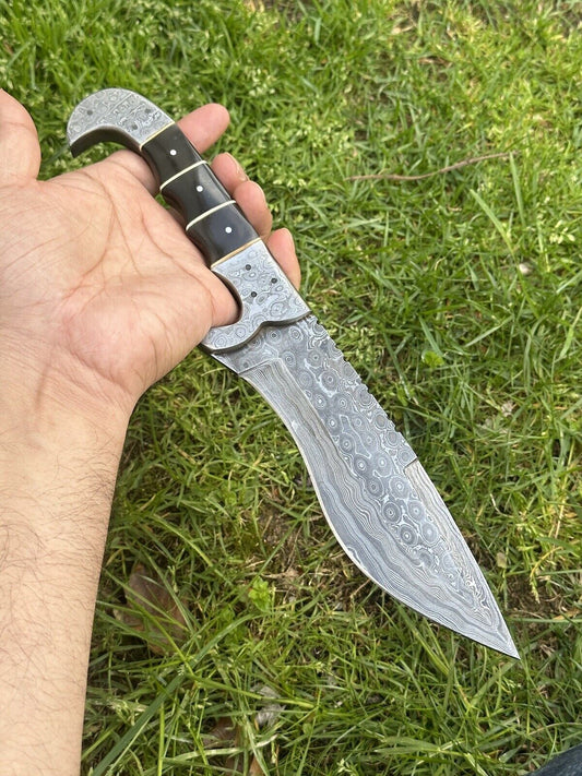 Custom 12" Damascus steel hunting knife with buffalo horn handle and leather sheath