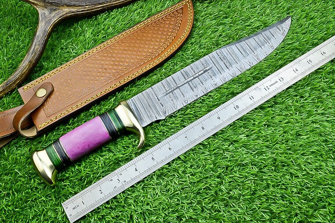 "Custom Damascus bowie knife with resin pakkawood handle and brass guard"
