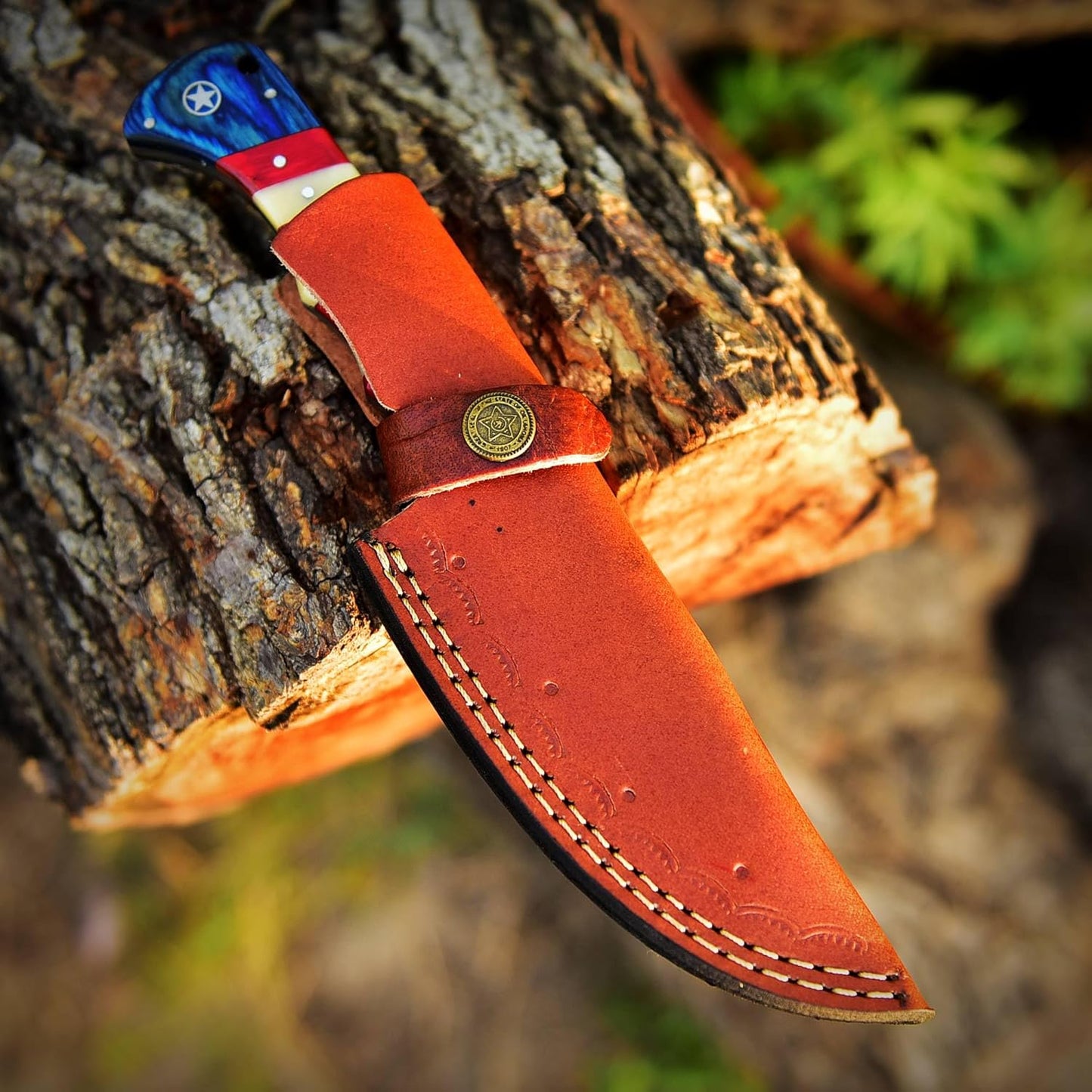 Custom Damascus steel skinning knife with 4.5-inch blade and American flag handle, ideal for precision skinning and outdoor enthusiasts