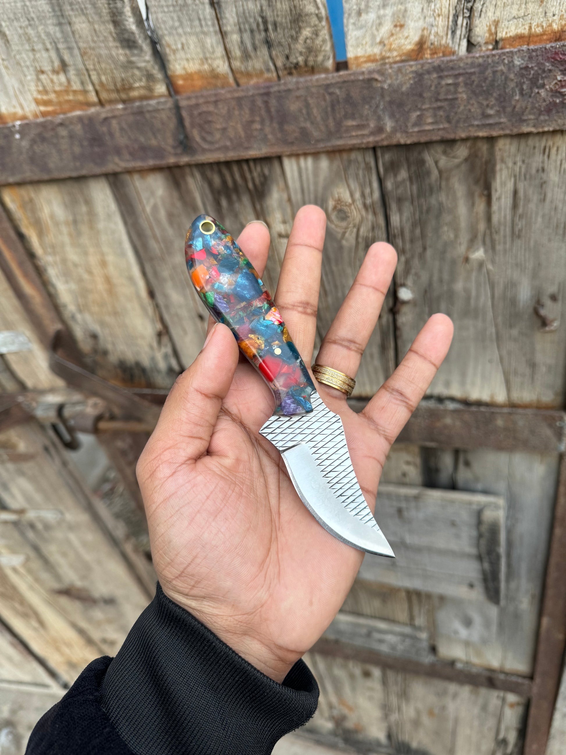 Custom Western cowboy knife with a durable rasp tool blade and ergonomic resin grip
