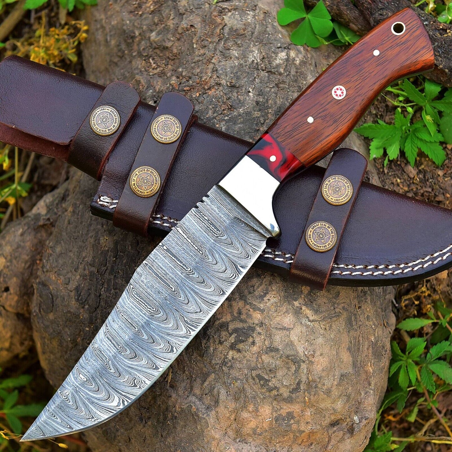 "Custom handmade 4.5-inch Damascus steel skinning blade with rosewood and resin handle, featuring a steel bolster for precision and durability"