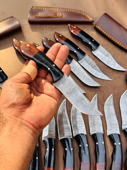 Custom handmade 4.5-inch Damascus steel skinning knife with a resin and rosewood handle, ideal for precision cuts and outdoor use