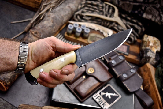 Custom handmade 4.5-inch J2 steel skinning knife with camel bone handle for precision skinning, durable and ergonomic design"






