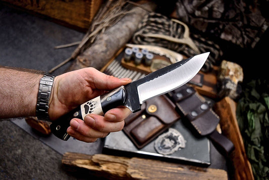 Custom handmade 4.5-inch skinning blade with J2 steel, buffalo horn and camel bone handle, ideal for precision skinning tasks
