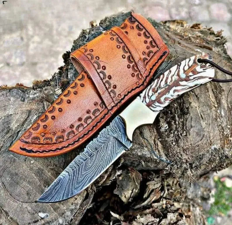 Custom handmade 8-inch western knife with a Damascus steel blade, pain cone handle, brass bolster, and a belt rope leather sheath