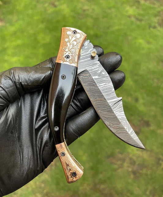 Custom handmade Damascus folding pocket knife with colored bone handle and brass engraved bolster