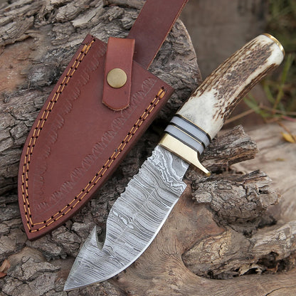 "Custom handmade Damascus steel guthook skinning knife with a 9-inch blade and stag horn handle."