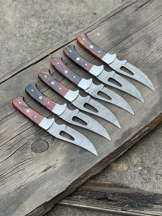 Custom handmade Damascus steel hunting blade with a 4-inch wair cutt blade, resin handle, and steel bolster, perfect for outdoor use and collectors.