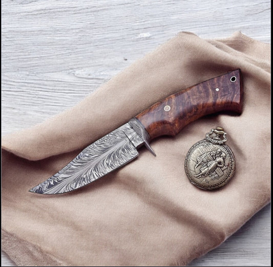 Custom handmade Damascus steel hunting knife with rosewood handle, Damascus steel guard, and leather sheath. Perfect for outdoor and hunting use