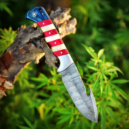 Custom handmade Damascus steel skinning knife with 4.5-inch blade and American flag handle, perfect for hunting and outdoor use
