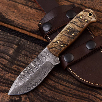 Custom handmade Damascus steel skinning knife with a 4.5-inch blade and a sheep horn handle, ideal for precision skinning and outdoor use.