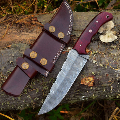 Custom handmade Damascus steel skinning knife with a 4.5-inch blade and durable G10 handle, ideal for precision hunting and outdoor use.