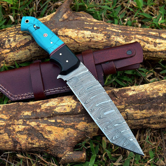 Custom handmade Damascus steel skinning knife with a 4.5-inch blade and resin handle, designed for precision and durability in hunting and outdoor tasks.