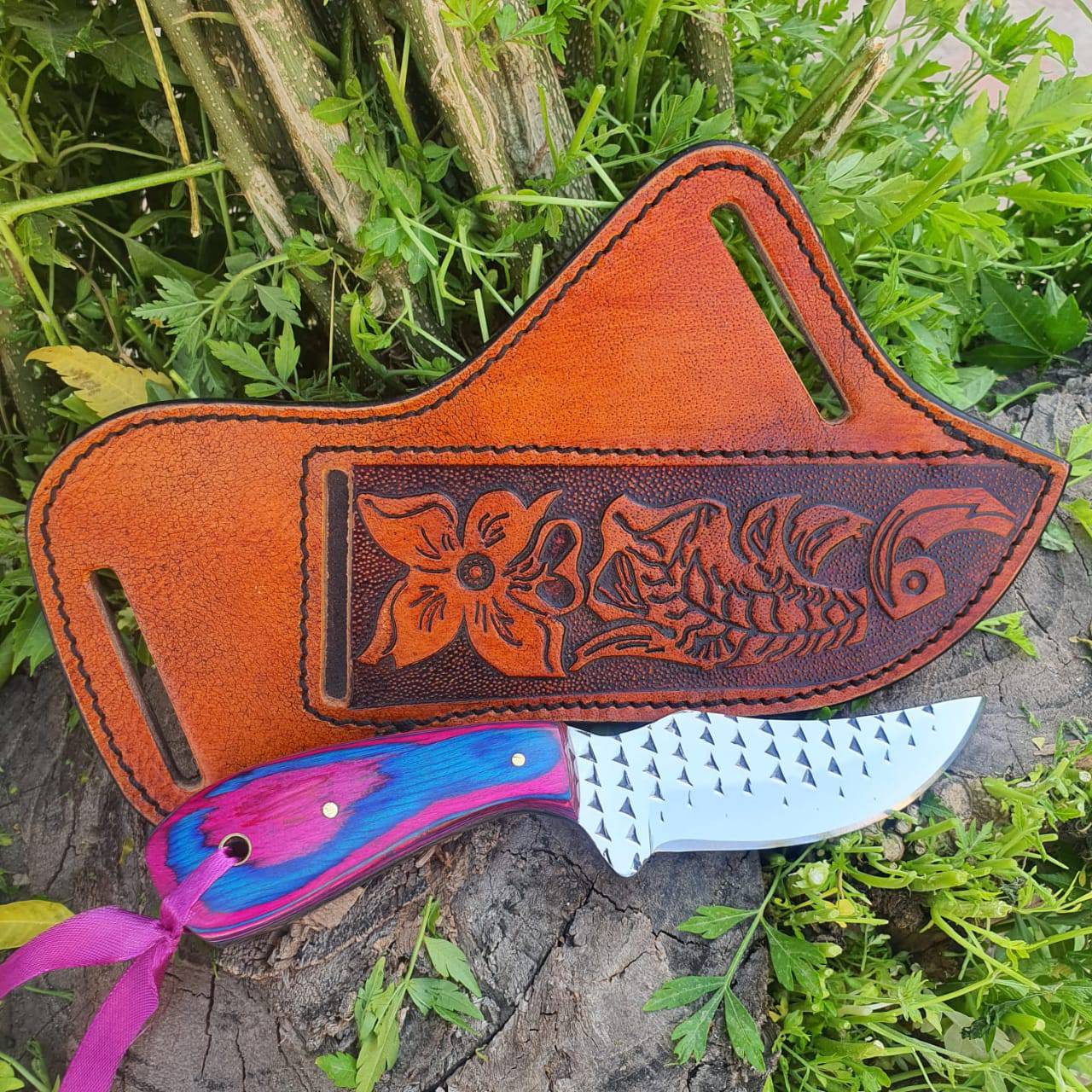 "Custom handmade cowboy knife with pakkawood handle and leather sheath"