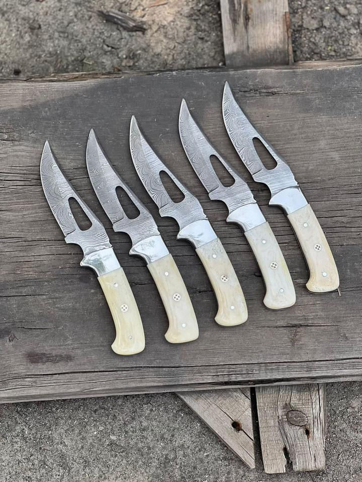 Custom handmade hunting knife with a 4-inch Damascus steel blade featuring wair cut patterns, camel bone handle, and steel bolster