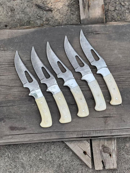 Custom handmade hunting knife with a 4-inch Damascus steel blade featuring wair cut patterns, camel bone handle, and steel bolster