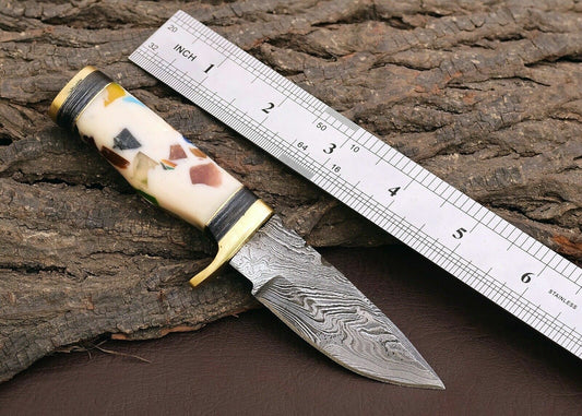 "Custom handmade outdoor knife with a 3-inch Damascus steel blade."
