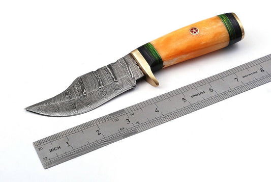 Custom handmade skinning knife featuring a 4.5-inch Damascus steel blade and a camel bone and rosewood handle, accompanied by a leather sheath.