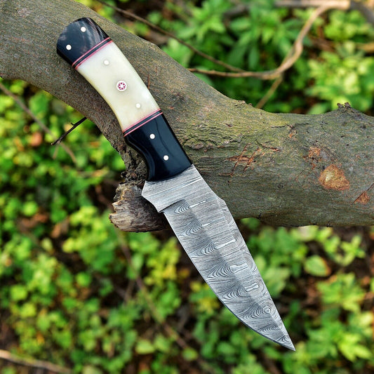 Custom handmade skinning knife set with 4.5-inch Damascus steel blade, camel bone and resin handle, and included leather sheath"