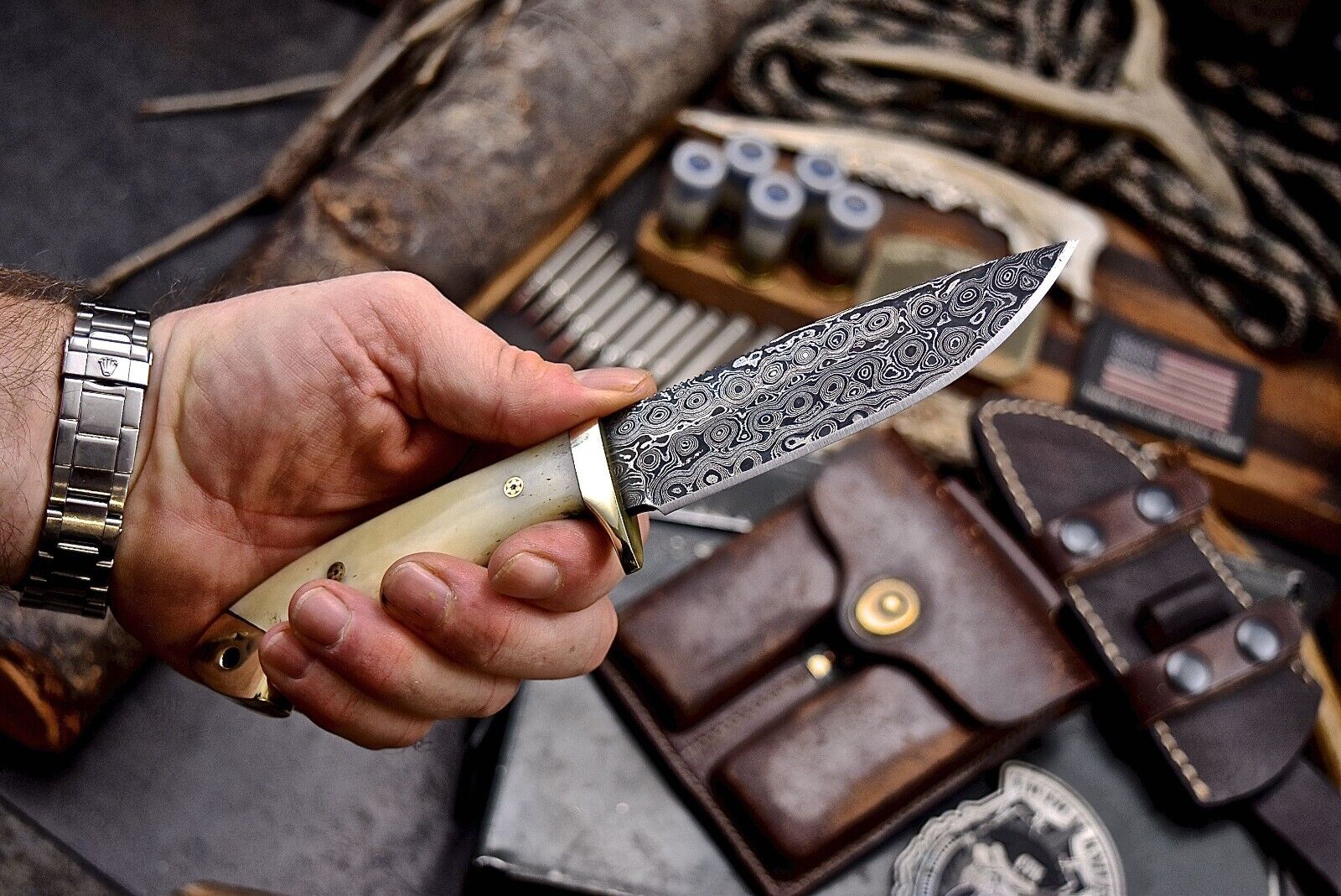 Custom handmade skinning knife with 4.5-inch Damascus steel blade and camel bone handle featuring brass bolster, includes leather sheath for hunters and collectors